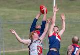 Lilydale's Louis Venn takes a towering mark. Pictures by Paul Scambler