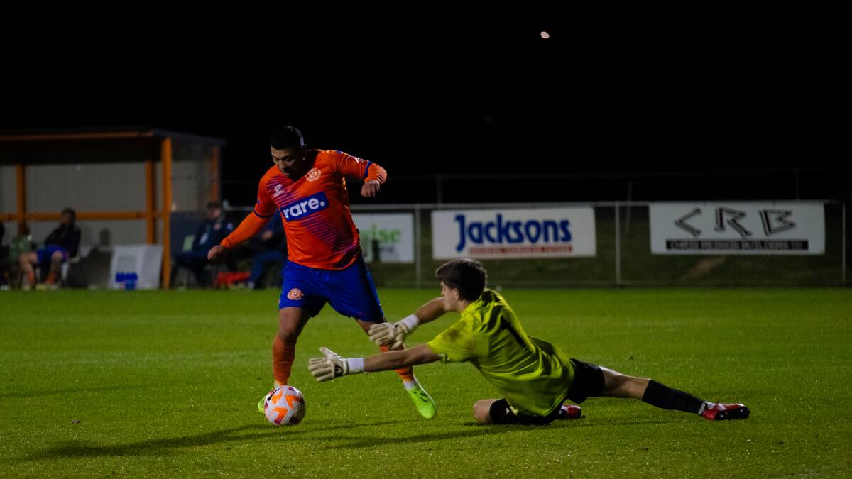 Riverside Olympic striker Emanuel Ponce is denied by Launceston United keeper Noah Curtis. Picture by Will Fleming