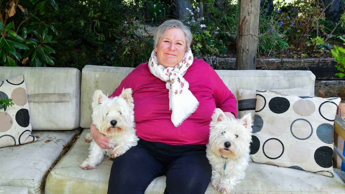 HAPPY HOME: Jan Davis and two of her dogs Kiwi and Loki. Picture: Neil Richardson