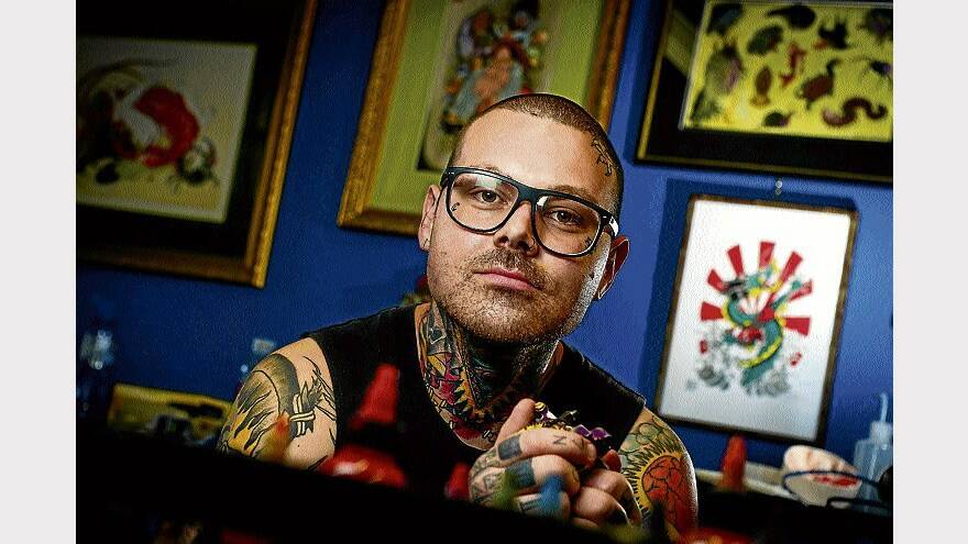 Living canvas . . . tattoo artist Chris White practises what he preaches. Picture: Phillip Biggs