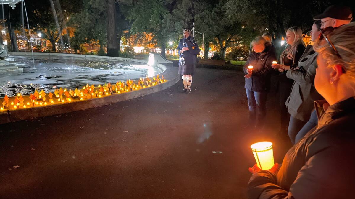 VIGIL: Pipe major Gaynor Spriggs from Tasmania Police Pipe band plays Amazing Grace. Picture: Alison Foletta