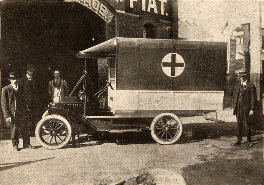 Ambulance with unknown men pictured on March 6, 1919