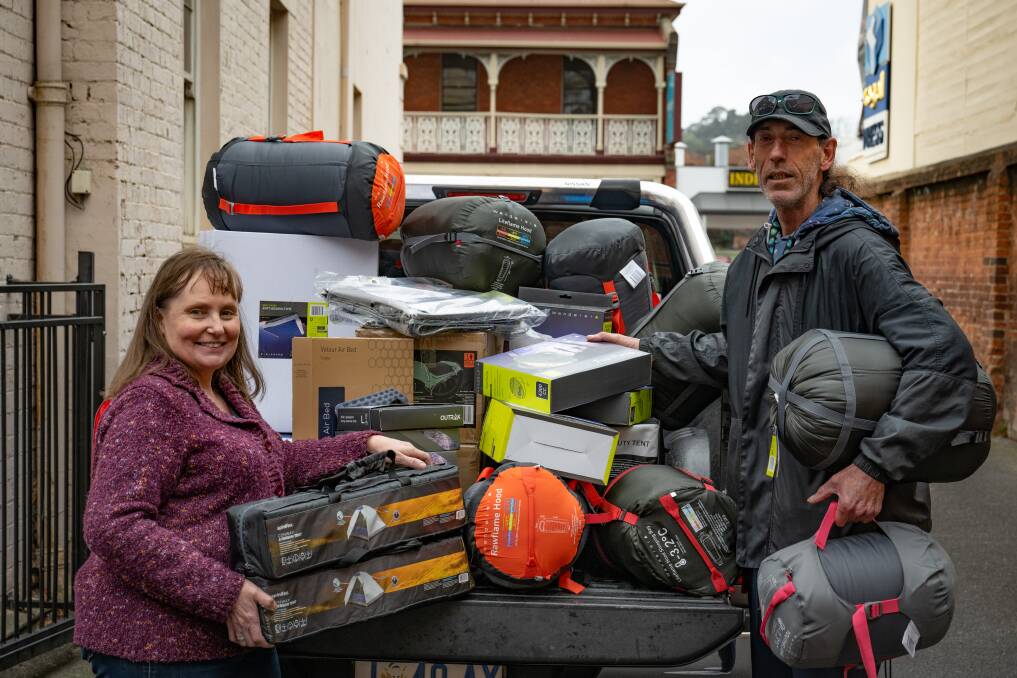 Shekinah House's Louise Cowan with sleeping bags, tents and mattresses that Gary Davenport of Launceston has donated. Picture by Paul Scambler