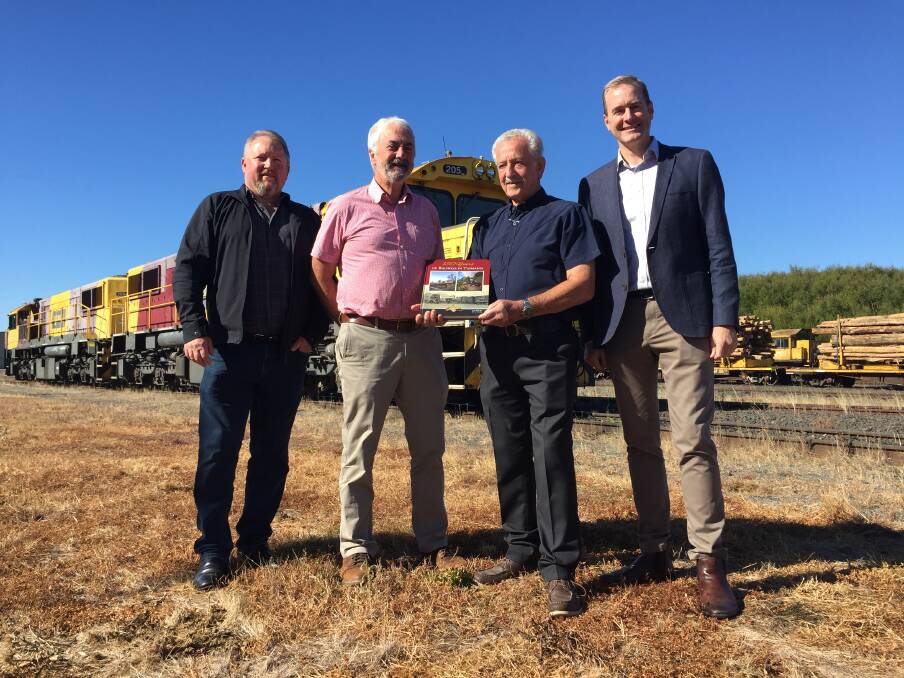 RAILWAYS: Authors Lou Rae and Tony Coen with TasRail chief executive Steven Dietrich and Transport minister Michael Ferguson at the book launch. Picture: Adam Daunt