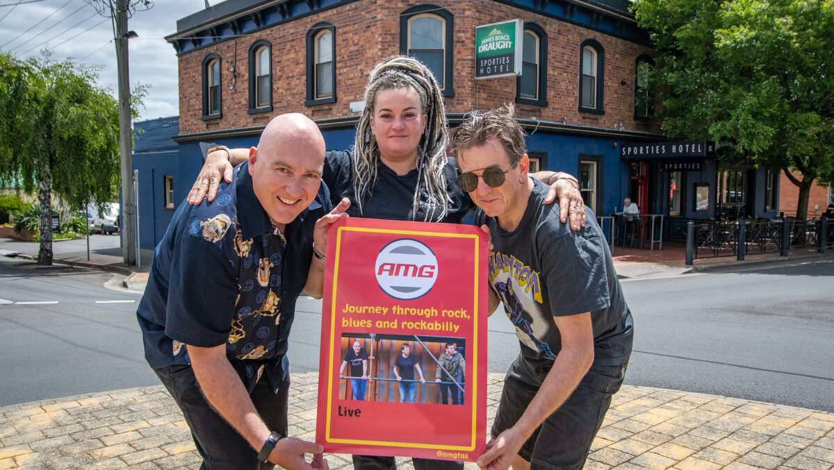 FESTIVE SPIRIT: Michael Bailey and Andy Wells from Launceston band AMG, with Sporties Hotel Venue Manager Kristie Chase. Picture: Paul Scambler