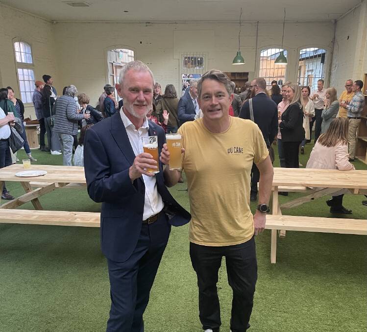 Launceston mayor Albert Van Zetten sharing a beer with DuCane Brewery's head brewer and founder Will Horan at the site's official opening. Picture by Luke Miller