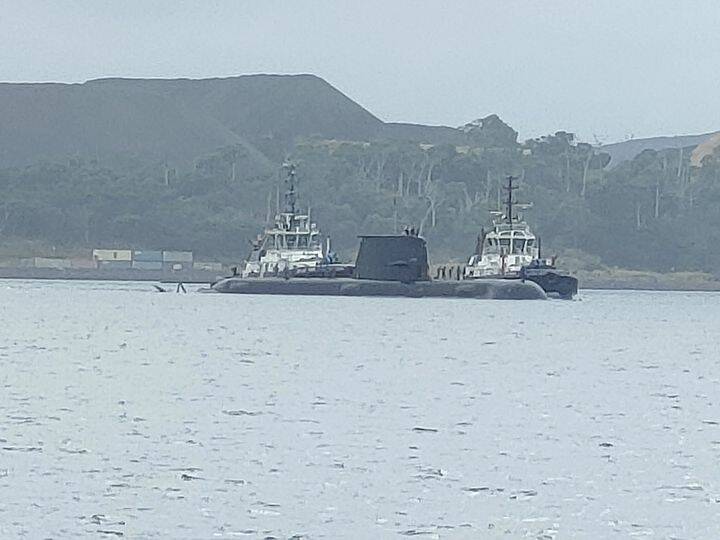 One of the submarines being guided into a berth off the Tamar River earlier on Wednesday morning. Source: Facebook/ Denise Lockhart 