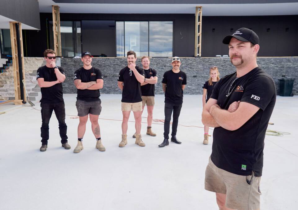 Sam Cooper with some of the crew from Zanetto Builders show off their Movember moustaches. Picture by Rod Thompson