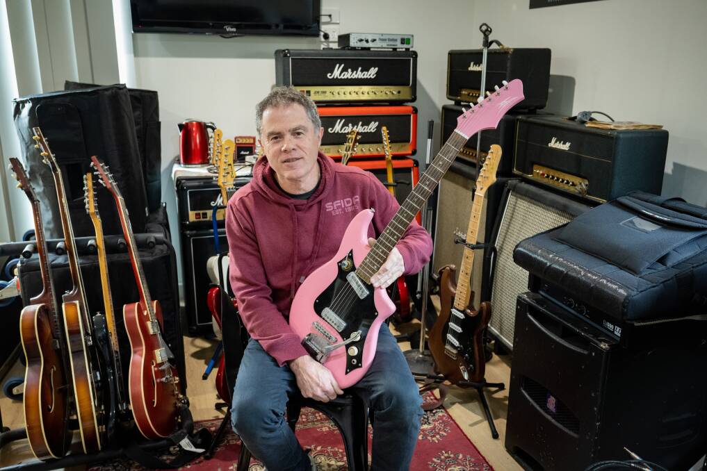 Dave Dobson with his 1960's Maton Flamingo in his home workshop. Picture by Paul Scambler