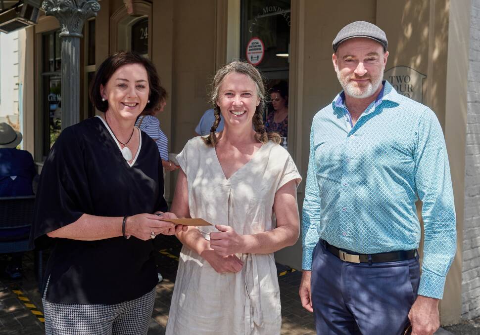 Launceston Gastronomy chairwoman Jane Bennett and group member Andrew Pitt with competition prize winner Kathryn Kahl.