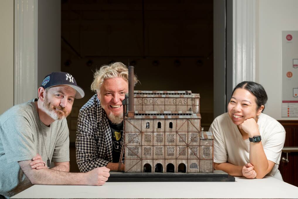 Joshua Smith of Norwood SA, David Hourigan of Melbourne and Mylyn Nguyen of Sydney, pictured with David's model of the Launceston Gas Works. Picture Phillip Biggs