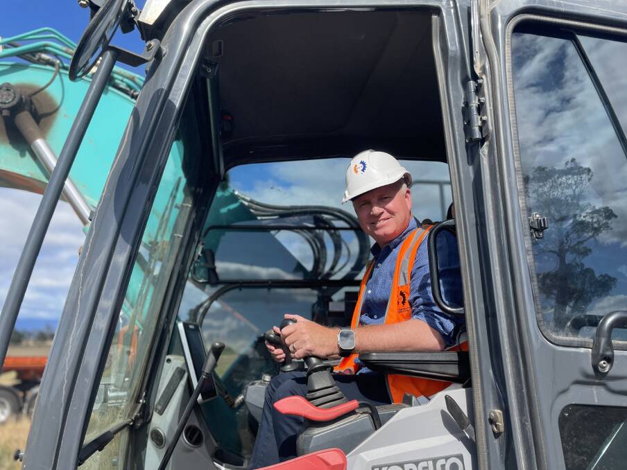 Premier Jeremy Rockliff has a go in the Excavator. Picture by Duncan Bailey