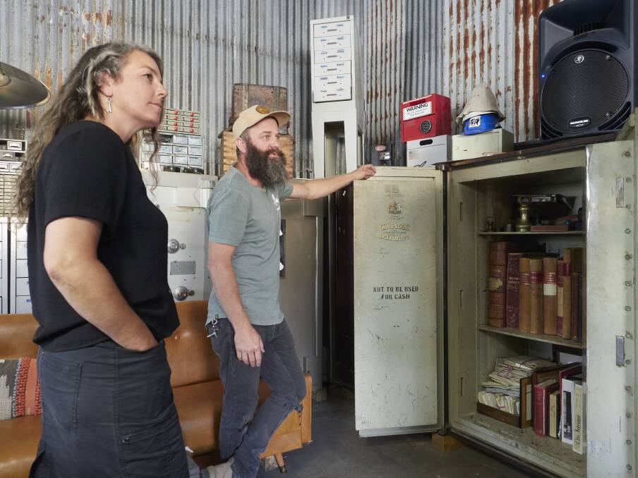 Kate and Rudy inspect the contents of a safe dating back to the 1800s. Picture by Rod Thompson.