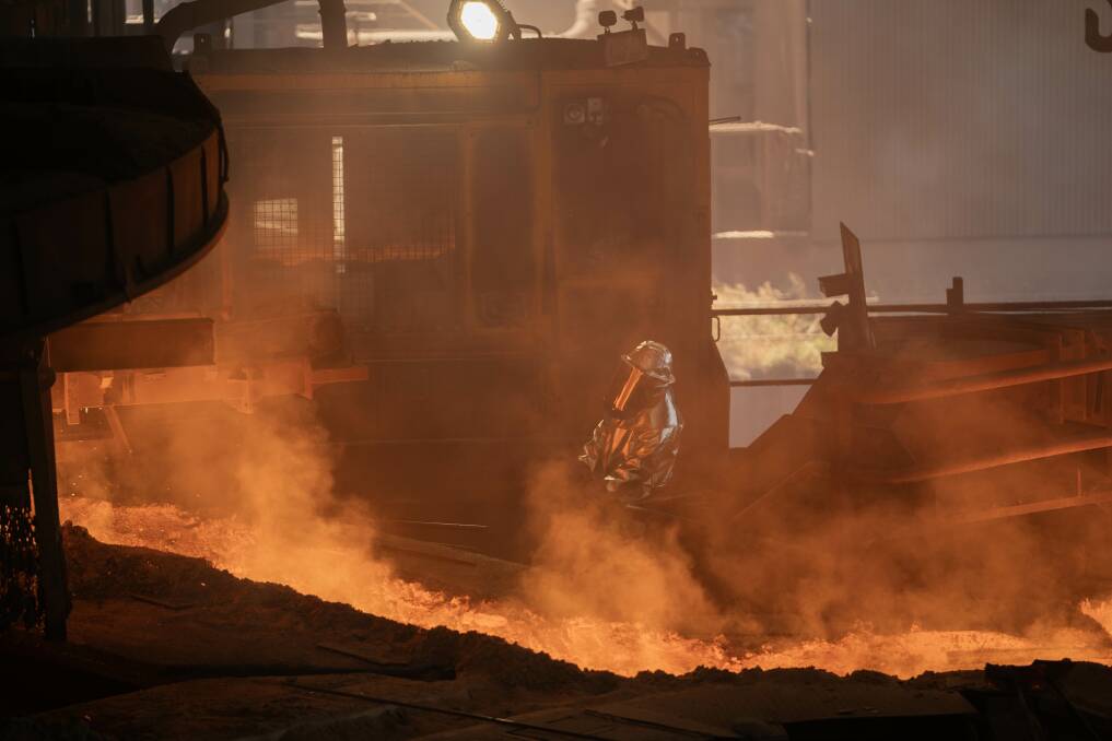 Workers in the furnace at Liberty Bell Bay. Picture by Maren Preuss, ABC News.