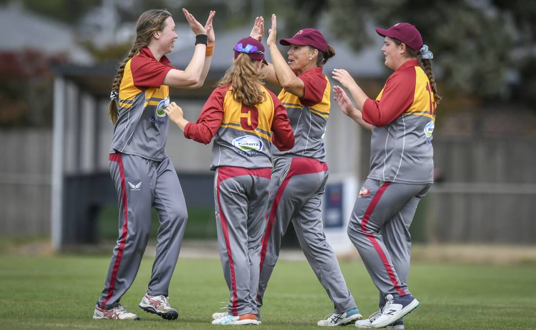 Cricket North West women's representatives celebrate a wicket. Pictures by Craig George