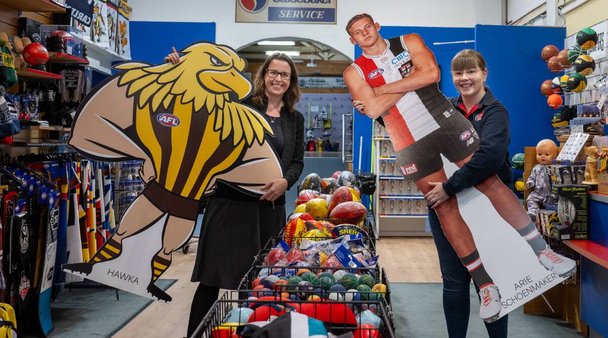 Amanda McEvoy, Executive Officer, Launceston Central with Hawka and Olivia Young of Balls n Bumpers with the cutout of St Kilda's Arie Schoenmaker. Picture by Paul Scambler