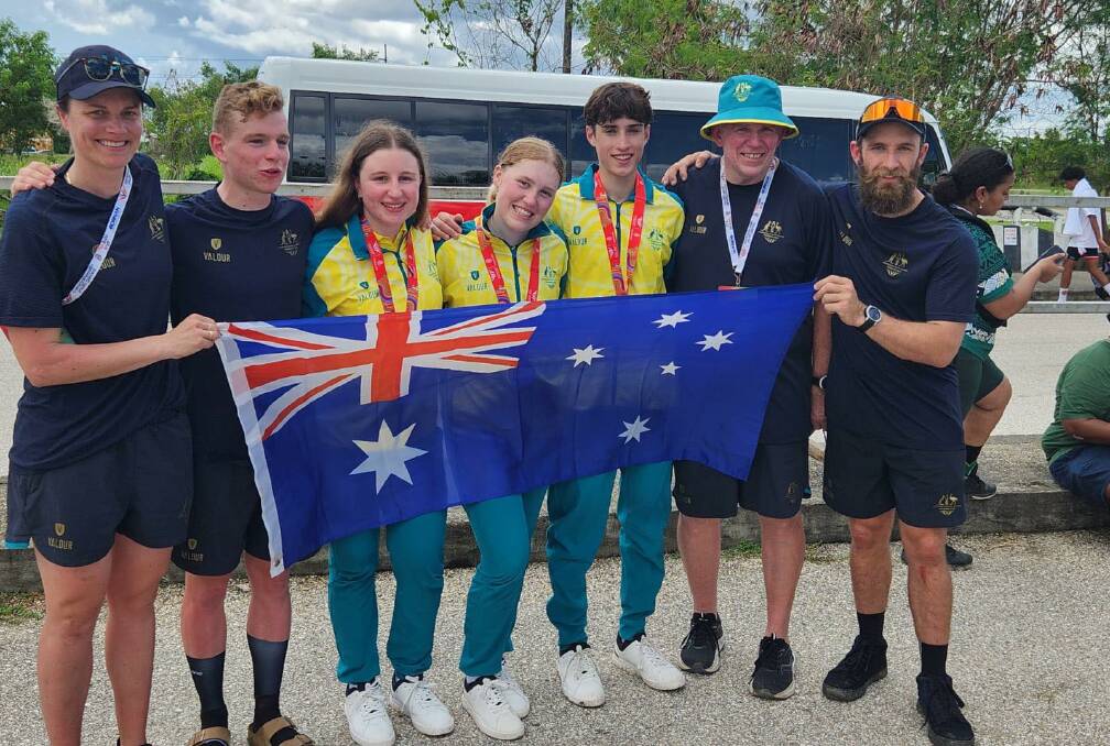 Sam McKee (second from left) with the Australian team in Trinidad. Picture supplied