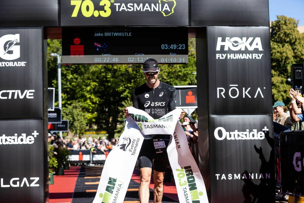 Jake Birtwhistle winning Ironman 70.3 Tasmania last February. Picture by Korupt Vision