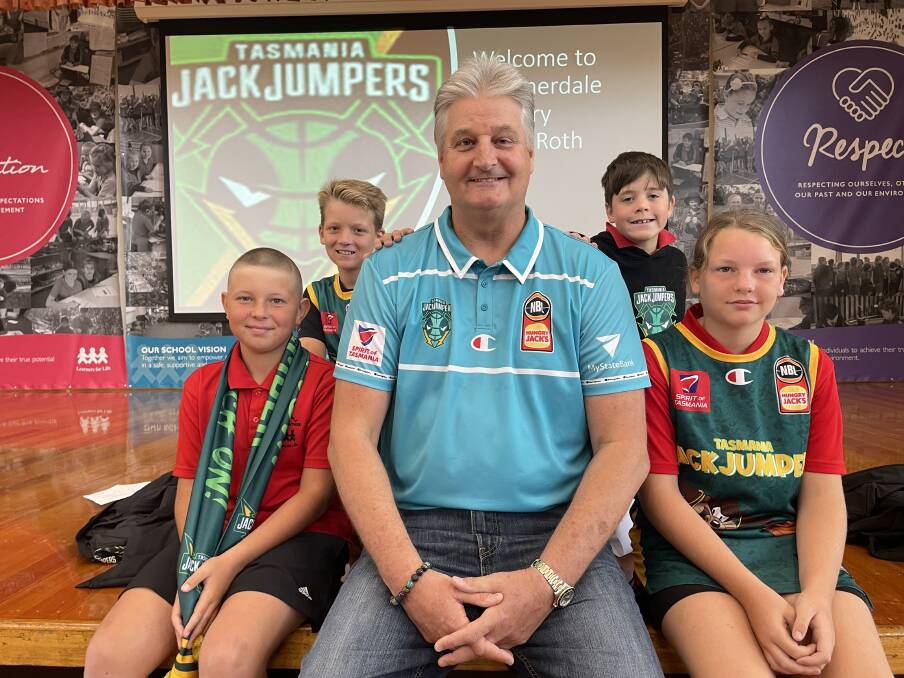 Tasmania JackJumpers coach Scott Roth is welcomed to Summerdale Primary School by Nate Mitchell-Evans, Darwyn Edwards, Arlen Grady and Aimee Jordan. Picture by Rob Shaw