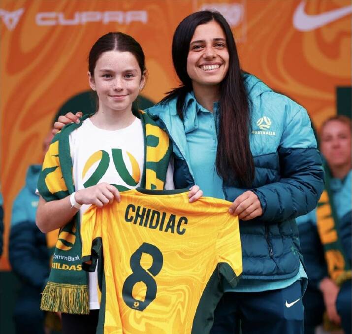 Matilda Smith presenting Alex Chidiac with her shirt in Melbourne. Picture supplied