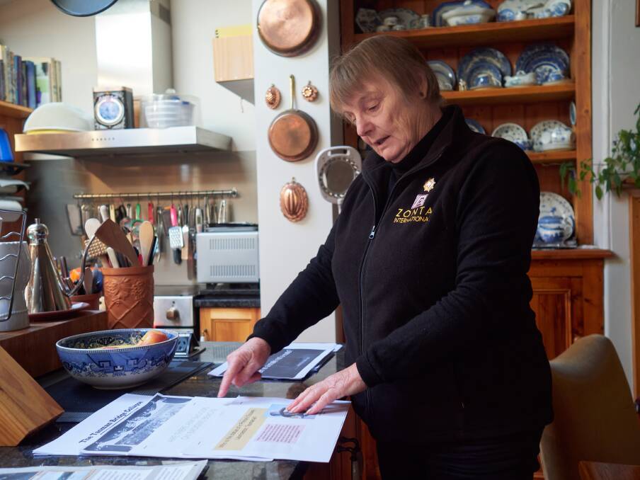 Carol Fuller of the Launceston Historical Society with sample work of student projects. Picture by Rod Thompson. 