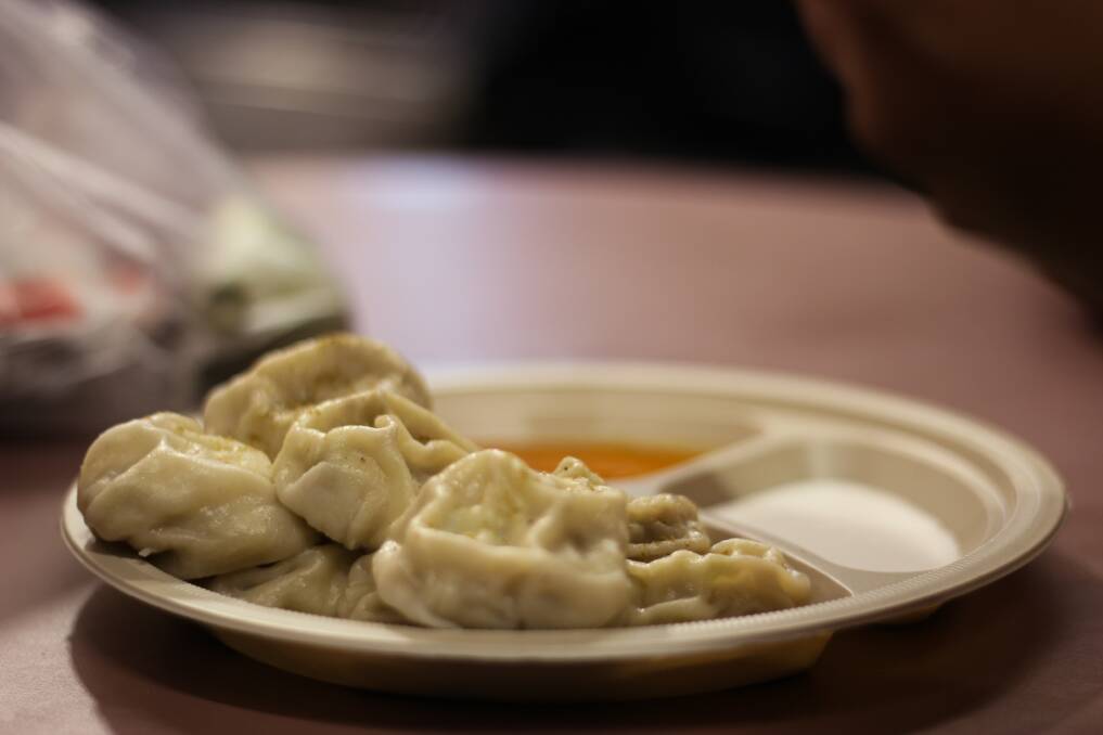 Steamed momos with chutney are a popular dumpling in Nepal. Picture by Tek Bahadur from Unsplash. 