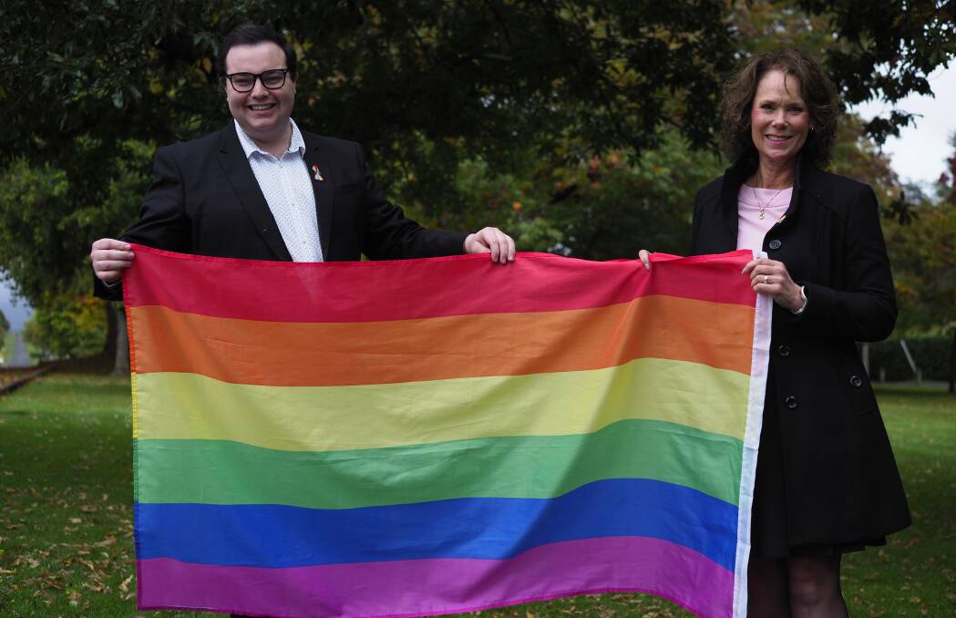 Meander Valley councillors Ben Dudman and Anne-Marie Loader holding the rainbow flag in 2023. Picture by Joe Colbrook