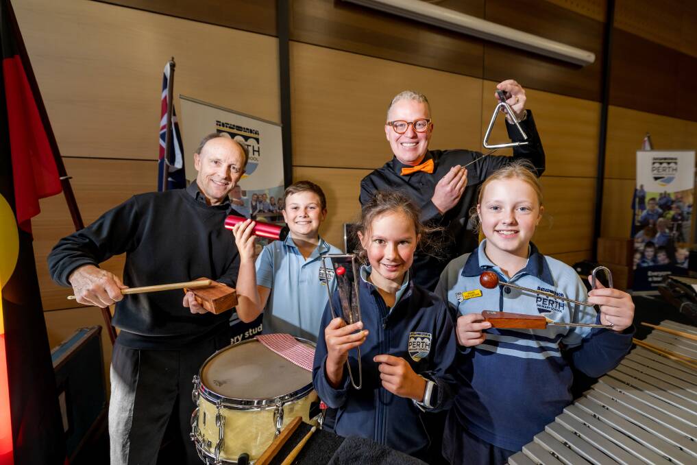 The Tasmanian Symphony Orchestra hosted a concert for students at Perth Primary School. Pictured are principal percussionist Gary Wain , Perth Primary School students Beau Shephard, Grace Tempest, Lilly Linley and conductor Jack Machin. Picture by Phillip Biggs