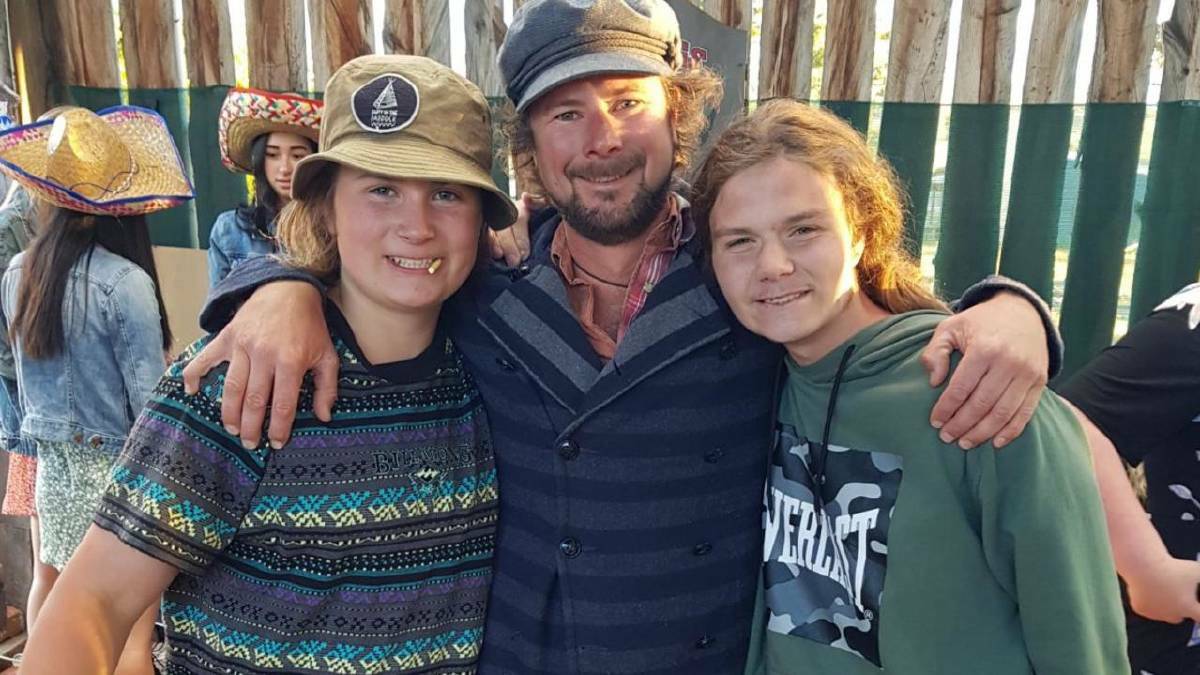 Nick Chugg (centre) started a music festival in honour of his son, Zander (right), where he'll perform this year in a band with his other son, Jo (left). Picture supplied