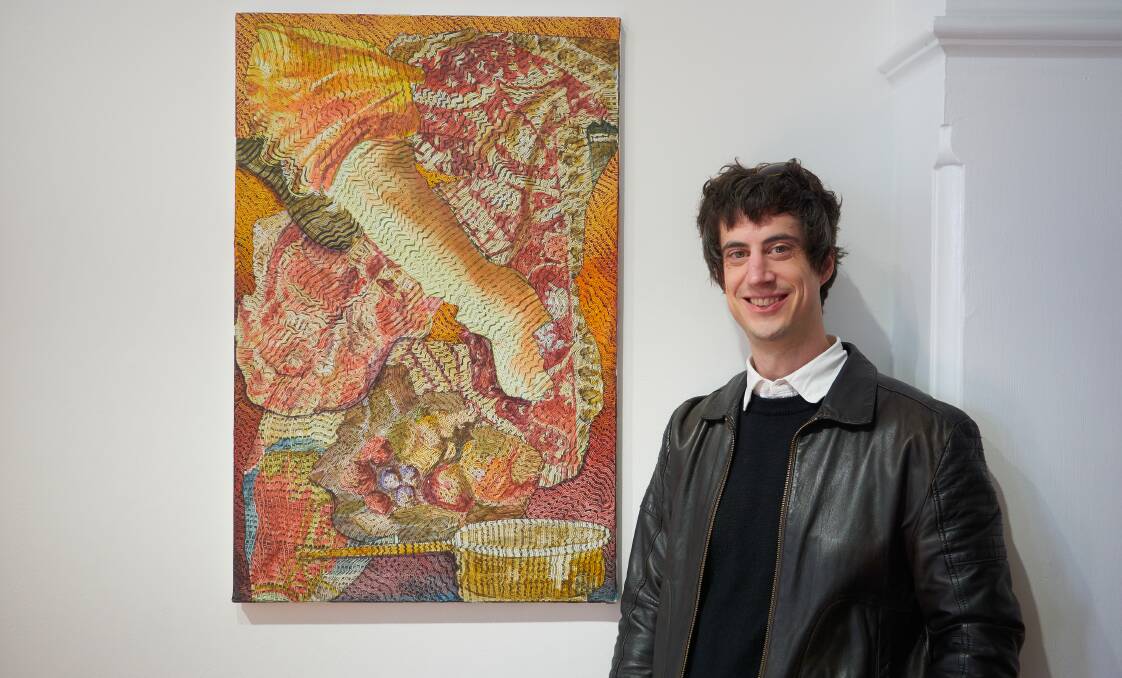 LAG Curator Tony Curran with Gregory Hodge's work "A Moveable Feast". Picture by Rod Thompson