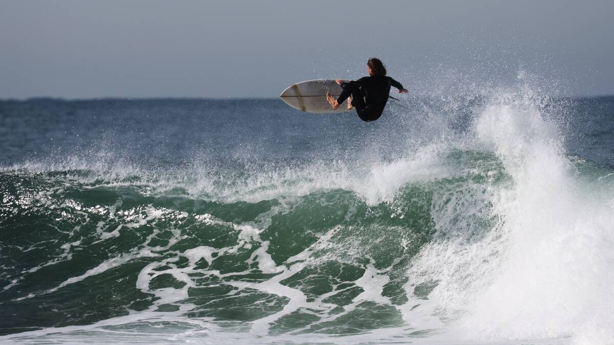 A surfer on the Newcastle coastline on Thursday 20th June, 2024. Picture by Peter Lorimer 