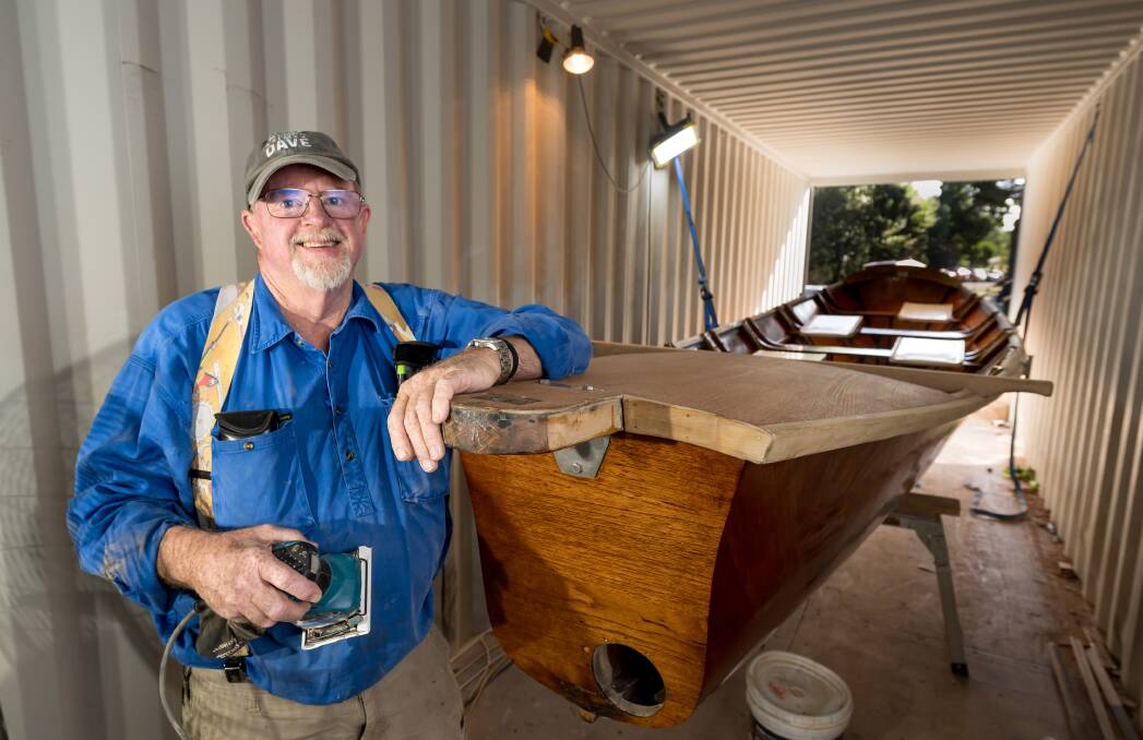 Exeter Men's Shed member and former builder David Gray is pictured with the boat, Dell Luck. Picture by Phillip Biggs