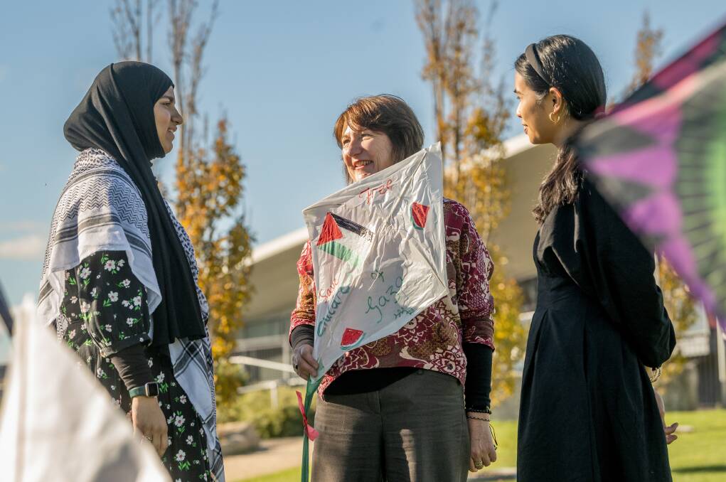 Student and speaker Aysha Mohamad, 16, event co-organiser Lauren Faulkner
and MC Nuri Mohamad at the 'Kites for Gaza' event, May 25. Picture by Phillip Biggs