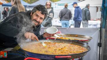 Juan Ignacio Enrique of Malvinas Paellas, cooks up a chicken and chorizo paella in
Launceston Civic Square for World Street Eats. Picture by Paul Scambler