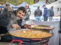 Juan Ignacio Enrique of Malvinas Paellas, cooks up a chicken and chorizo paella in
Launceston Civic Square for World Street Eats. Picture by Paul Scambler
