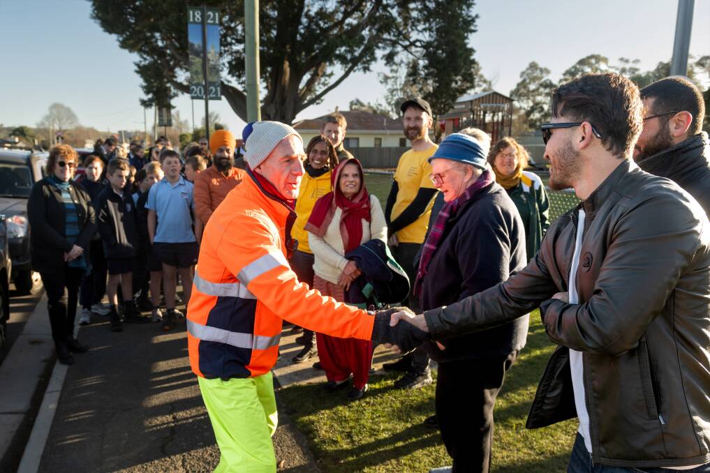 Migrant Resource Centre (MRC) Tasmania chairman and former premier Peter Gutwein shakes hands with supporters in Perth while on his Walk. Picture by Phillip Biggs
