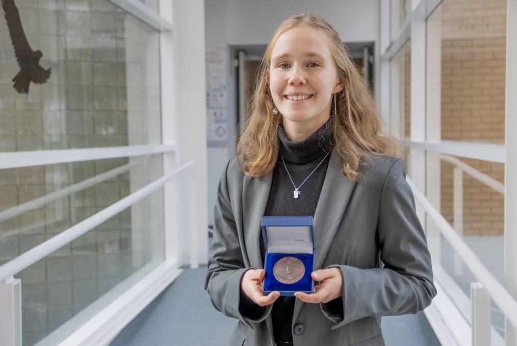 UTAS Honours graduate Sophie Young with the prestigious Astronomical Society of Australia's 2024 Bart Bok Prize. Picture supplied