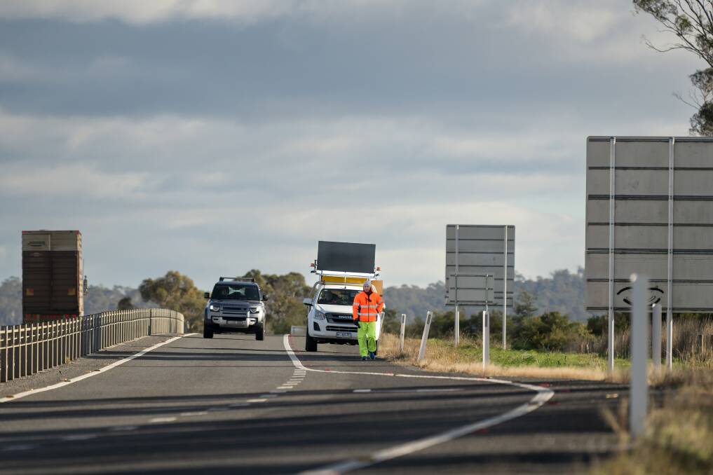 Peter Gutwein walks along the mildand Highway south of Perth on his walk from Burnie to Hobart. Picture by Phillip Biggs