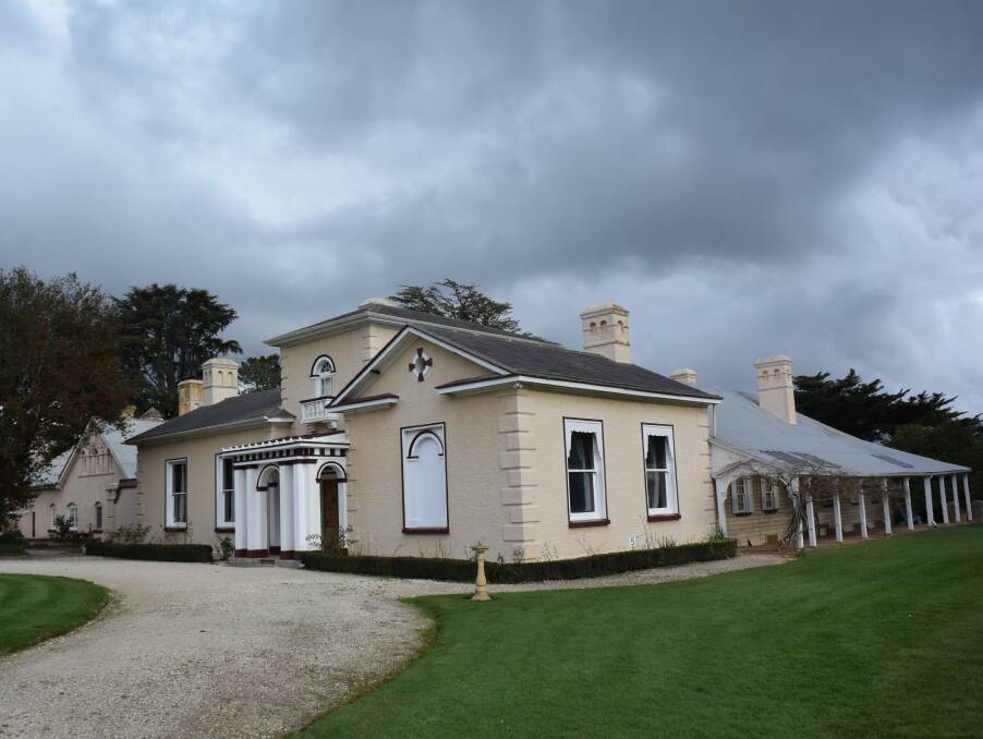 STORMY SKIES: The homestead at Woolmers Estate, featuring Italianate architectural detailing, is in pristine condition. 