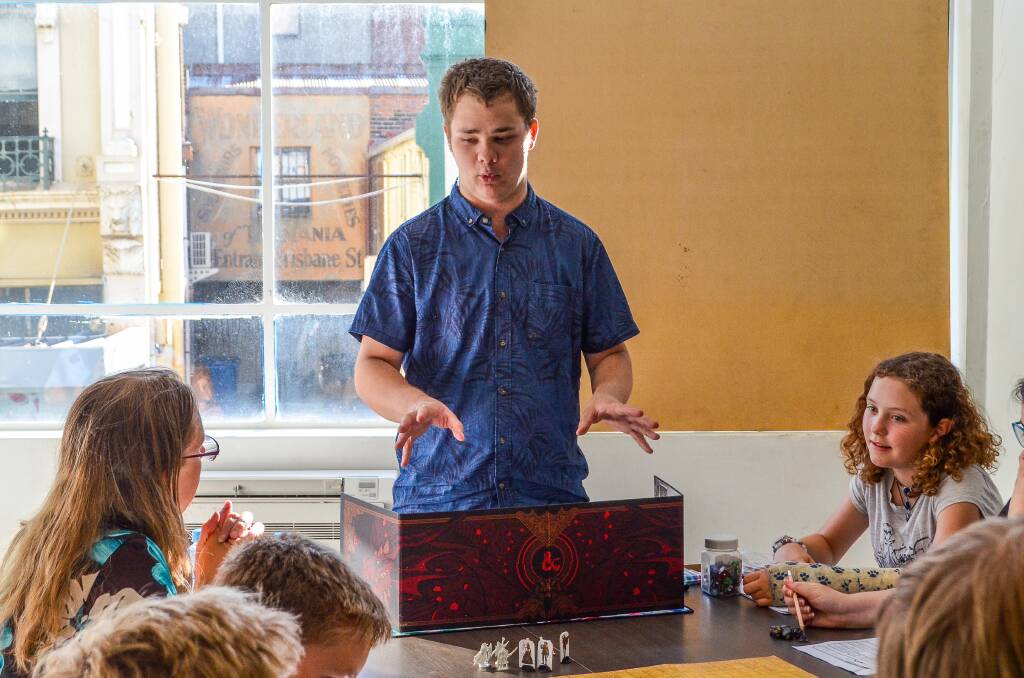 Chris Van Riel runs a session in Launceston teaching Dungeons and Dragons to newcomers. Picture: Adam Holmes
