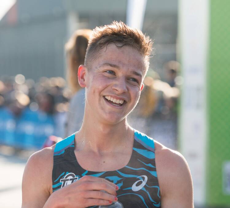 ALL SMILES: Isaac Heyne following his win in the 10km race at the Launceston Running Festival this year. 