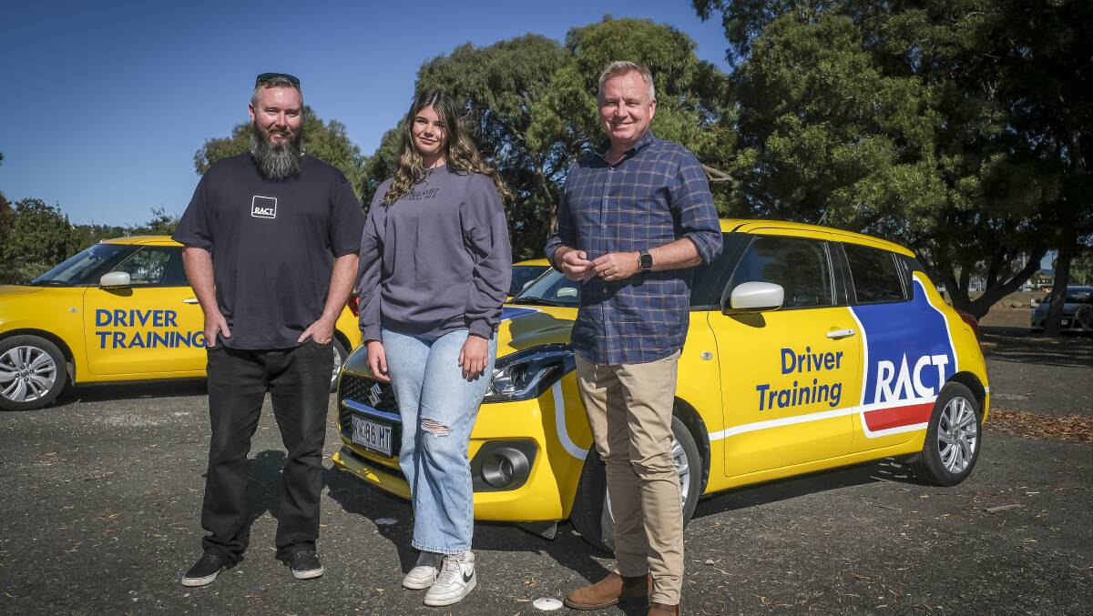 RACT driving instructor Craig Hopkins with Montana Mountney, 16, and Premier Jeremy Rockliff at an election campaign announcement on driver education in schools. Picture by Craig George.
