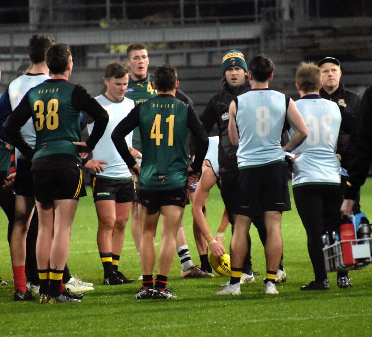 Tasmanian representative coach Mav Weller speaks to the playing group at training. Pictures by Josh Partridge
