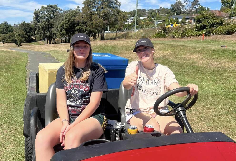 Jorja Parker and Cayley Quill drove the beer cart at St Pats' golf day. Picture supplied