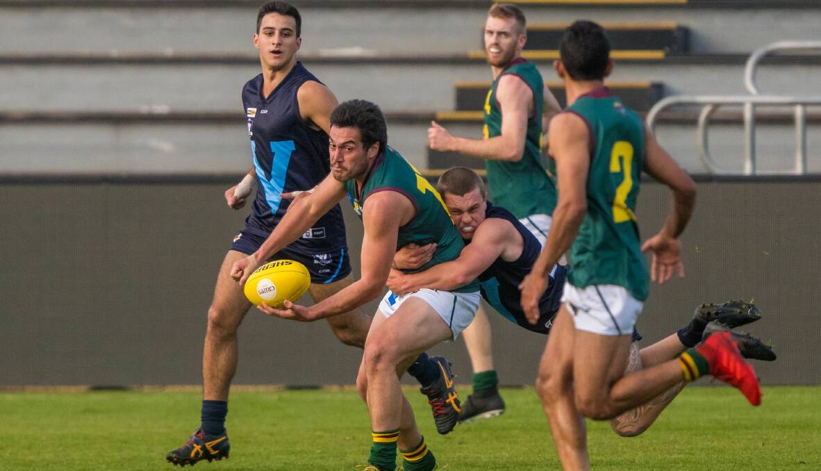 Phil Bellchambers disposes of the ball in the 2019 under-25 Tasmanian representative game. Picture by Phillip Biggs