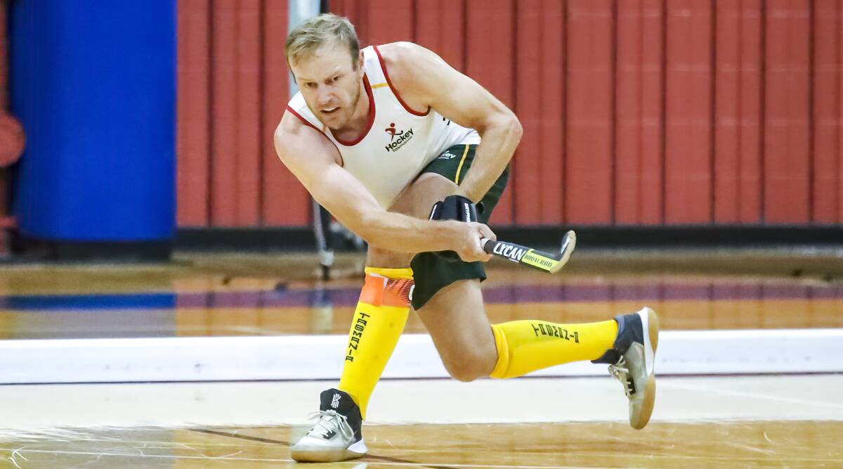 Tassie captain Tim Deavin passes the ball at the indoor hockey national championships. Picture by Click InFocus