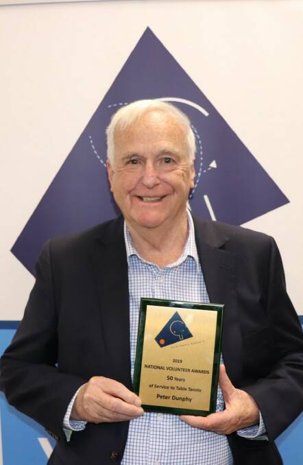 Proud: Northern Tasmanian Table Tennis Association president Peter Dunphy with his 50 years of service award. Picture: Supplied