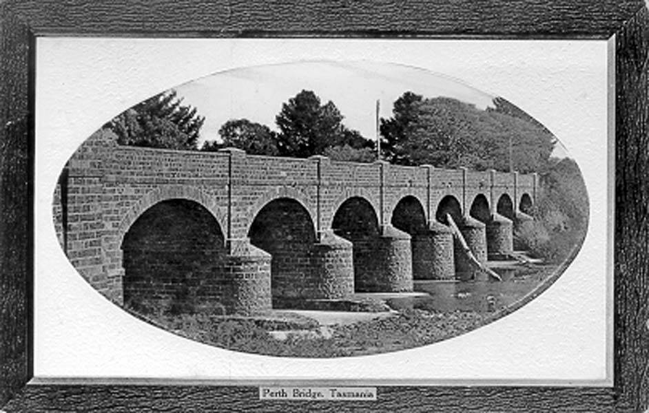 The Perth Bridge was built by convicts in 1837-39. The collapse of some masonry on the
approach to the bridge in 1841 damaged the water race and stopped works at the mill.
Picture: Tasmanian Archives, PH30-1-4914