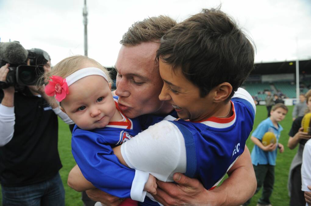 Thorp and wife Kyla with daughter Jaga after the 2013 TSL grand final.
