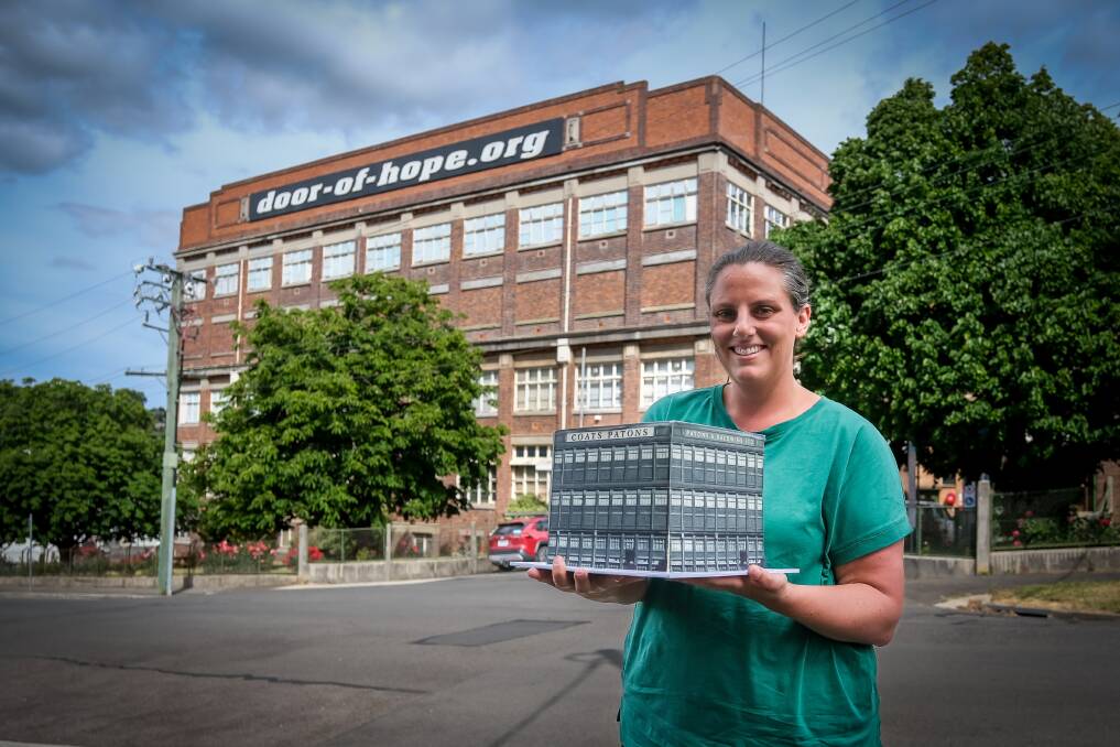 Chantelle Fair has created a Coats Patons cake for the building's 100th birthday. Picture by Craig George